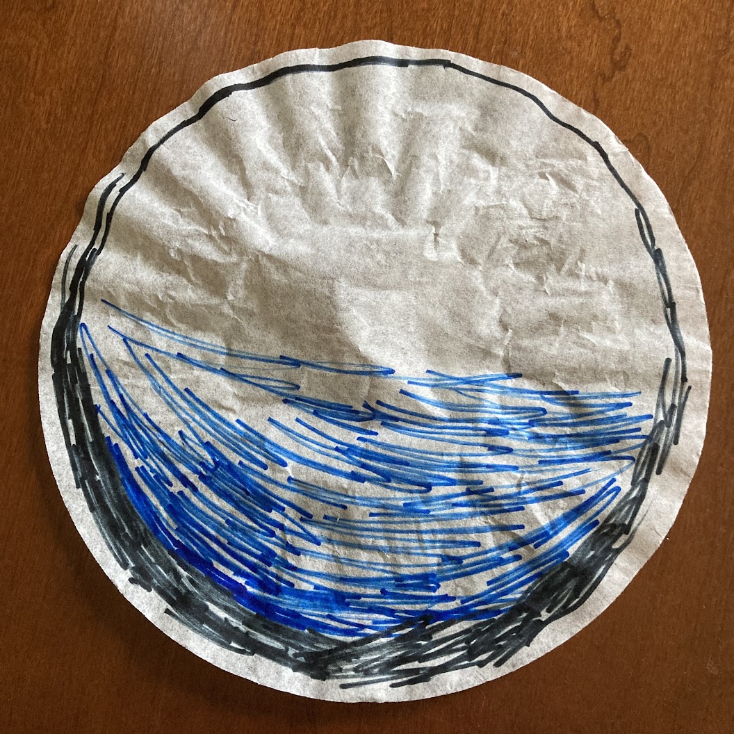 A coffee filter with a sketchy black circle drawn around the outside that is thicker on the bottom than the top and a blue ombre pattern on the bottom half.